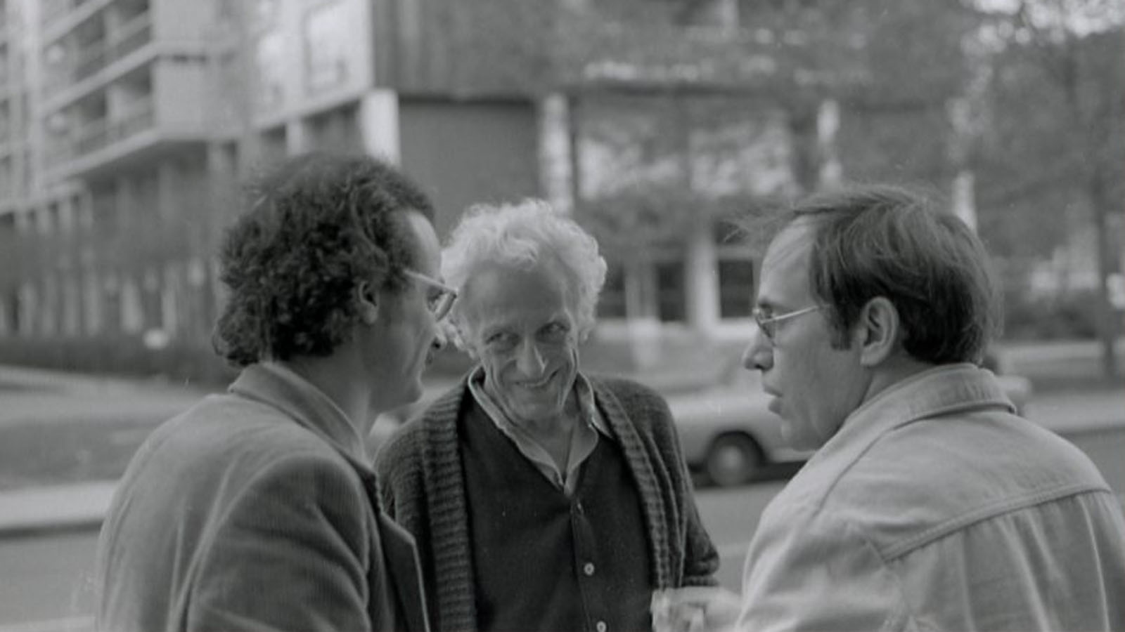 Serge Daney, Nicholas Ray, and critic John Hughes outside Bleecker St. Cinema