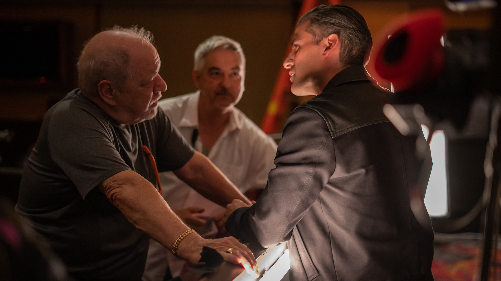 4175_D008_00423_RC
Director Paul Schrader, First AD Martin Jedlicka and actor Oscar Isaac on the set of their film THE CARD COUNTER, a Focus Features release.  
Credit: Heidi Hartwig / Focus Features