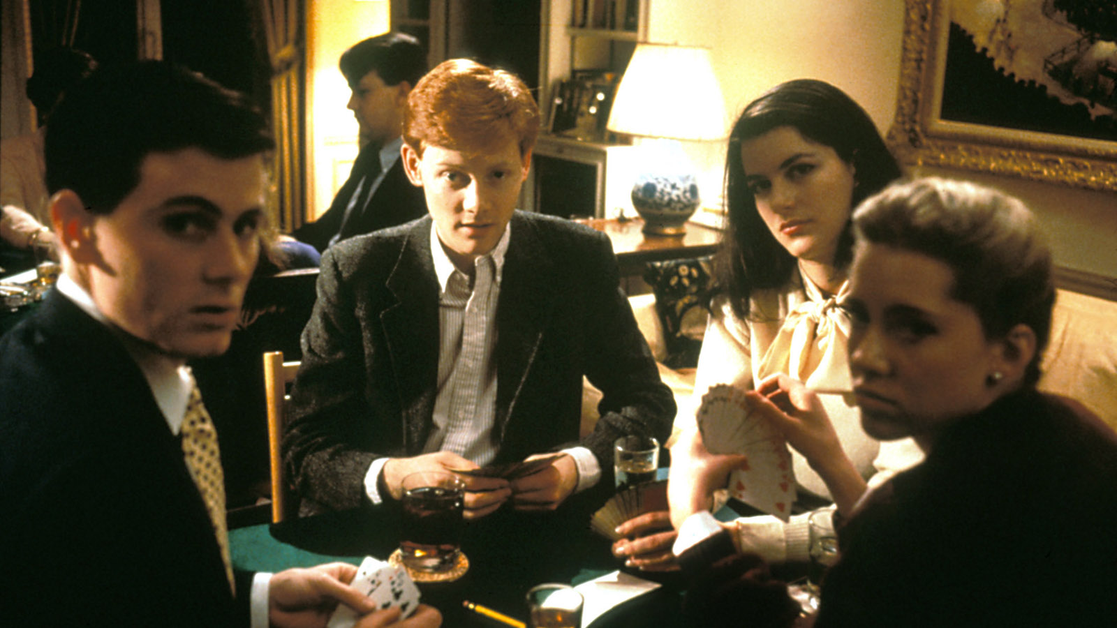 METROPOLITAN, Chris Eigeman (left), Edward Clements (center of frame), 	Allison Parisi (back right), 1990. ©New Line Cinema/Courtesy Everett Collection